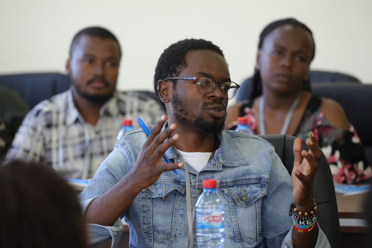 Diverse Kenyan community in discussion